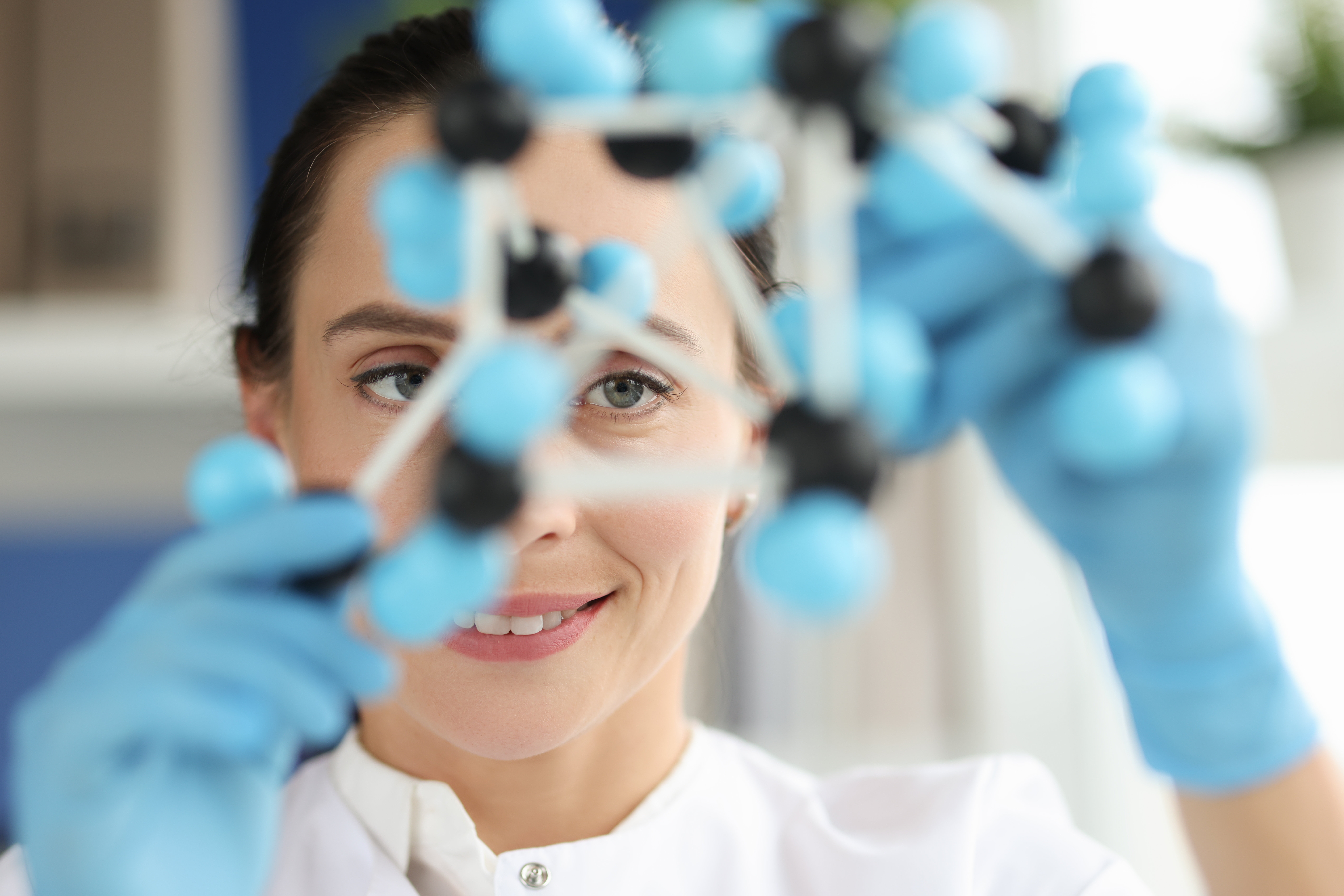 Woman scientist looks at dna layout. Properties of substances depend on structure and composition of molecules concept